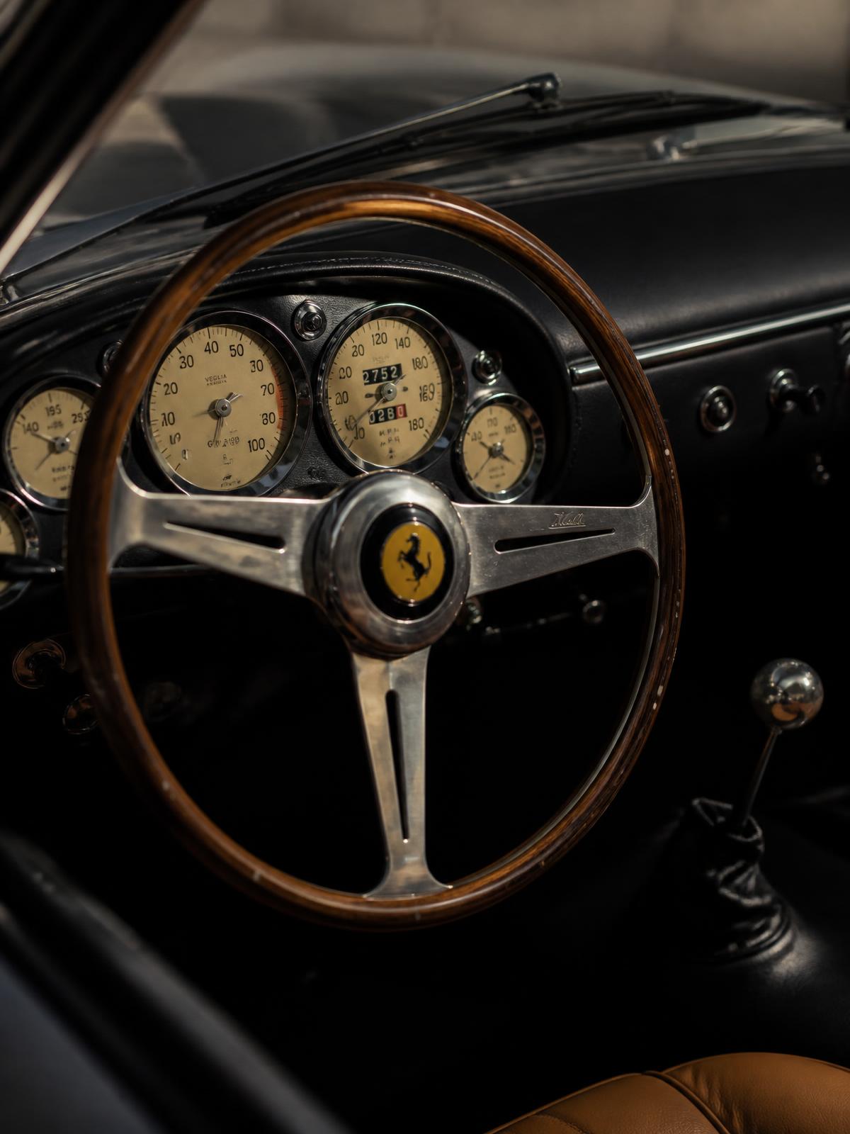 Wood-rimmed Nardi steering wheel and Veglia gauges
