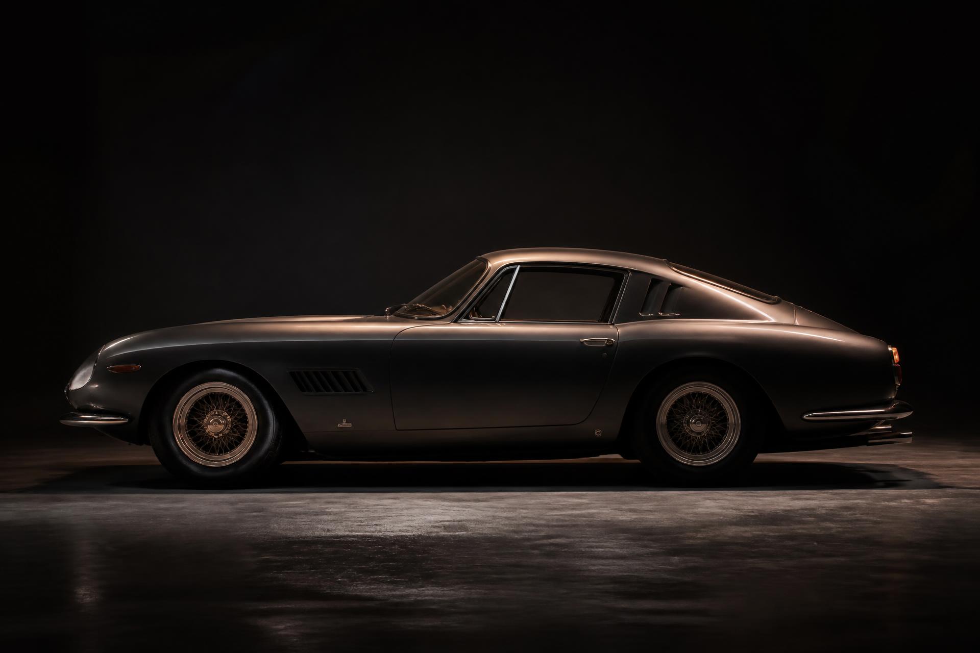 A 1960s Ferrari under low-key directional light